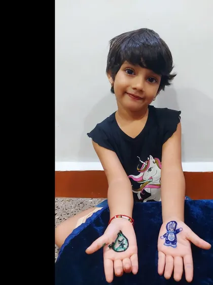 Another shot of my adorable client with her unique Doraemon and Angry Birds henna.