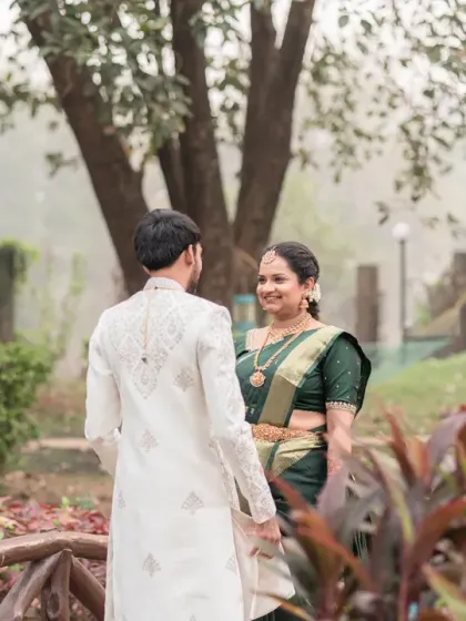 A quiet, meaningful glance between a couple during their South Indian wedding ceremony. This candid shot captures the deep connection and cultural richness of the moment.