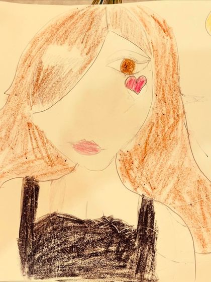 A sweet portrait titled 'The sunshine girl'. This drawing by one of our young students uses colored pencils to create a warm and happy character.