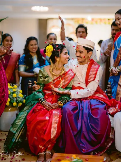 A quiet glance between the bride and groom amidst the wedding rituals. These are the unscripted moments that tell the real story of the day.