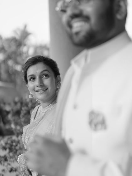 A duplicate of image 41, this black and white photo captures the bride's loving gaze towards her groom, creating a timeless and emotional portrait.
