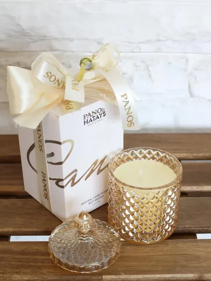 Our Crystal Cove scented candle, shown here with its elegant gift packaging. The cut-glass jar and soothing aroma make it a perfect gift for any occasion.