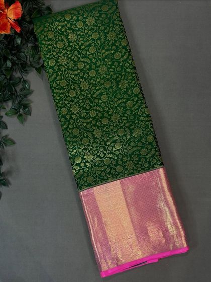 Another view of the beautiful green brocade saree with its pink border.