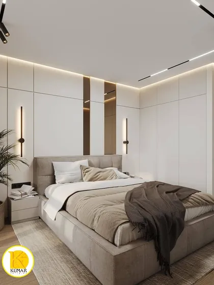 This bedroom features a sophisticated design with white paneled walls and integrated bronze-tinted mirrors. The wall sconces add a touch of modern elegance.