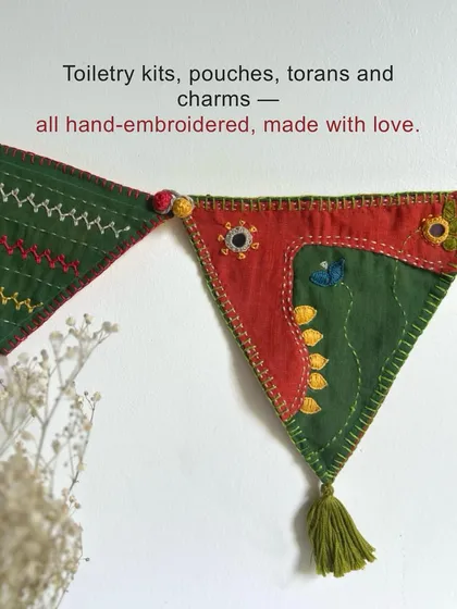 Our gift hampers include a variety of hand-embroidered items, from toiletry kits and pouches to decorative torans and charms, all made with love from surplus materials.