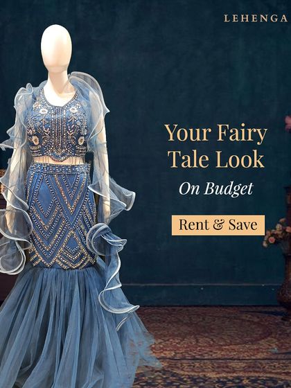 Your fairy tale look on a budget. This blue gown with a ruffled, off-shoulder neckline and embellished crop top is a playful yet elegant choice for a reception.