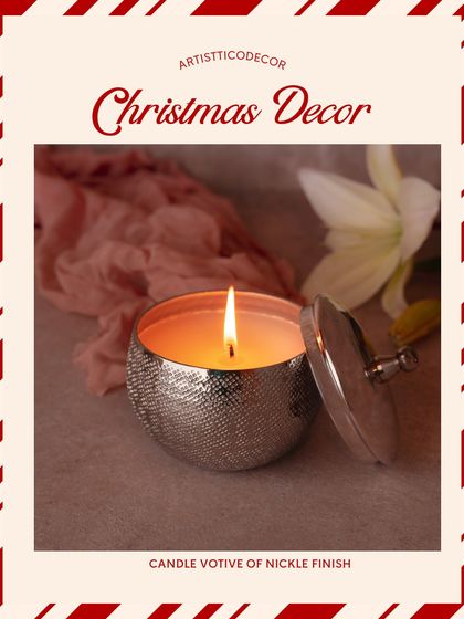 A candle votive with a nickel finish adds a soft, warm glow. It's a perfect small gift or an addition to your own collection of Christmas decor.
