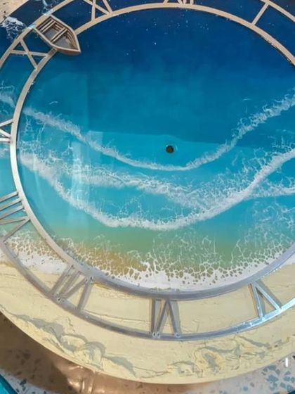 This beach art clock shows how I create realistic waves on a clock face. The addition of the Roman numeral dial and a tiny boat makes it a functional and charming piece of decor.