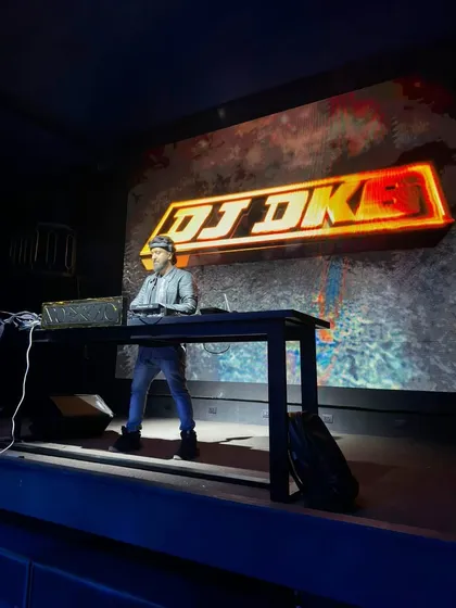 On stage, in my element. A professional setup is key for a large-scale event, and my custom LED visuals with Pioneer gear ensure the show looks as good as it sounds. This is my command center.