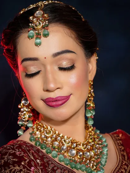 A close-up of the retro bridal makeup, showing the soft shimmer on the eyelids and the perfectly defined matte lips.