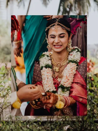 A candid moment of pure, uninhibited laughter from the bride Deeksha during a wedding ritual. These are the moments that truly show a person's spirit.