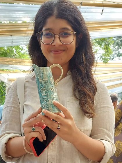 Another satisfied customer with one of my textured pitchers from the Ahmedabad Potter's Market. It's so rewarding to see my work appreciated.