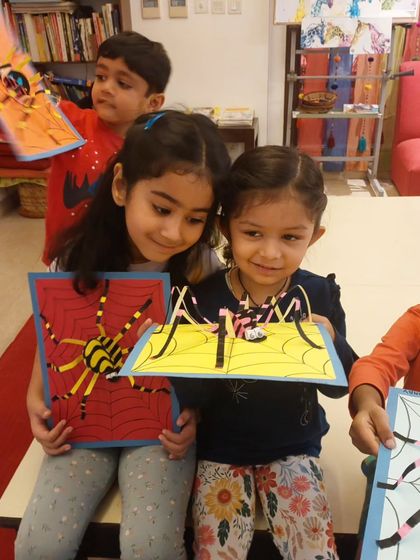 Happy Halloween from my youngest artists! They had so much fun creating these colorful 3D paper sculpture spiders, learning about basic construction and symmetry.