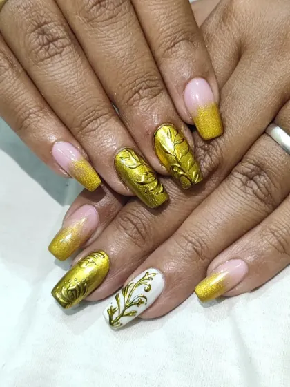 A full view of the golden bridal nail extensions, showing how the different designs on each nail come together for a cohesive and opulent look.