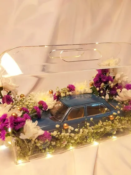 We believe in creating truly unique gifts that leave a lasting impression. This custom floral hamper featuring a Mercedes-Benz collectible car is a perfect example of how we can tailor a gift to any specific interest or theme.