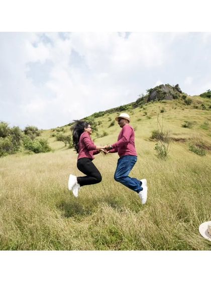 A jump for joy! This fun and energetic shot perfectly captures the excitement of starting a life together.