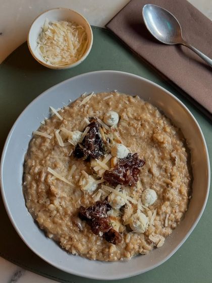 Our Wild Mushroom and Truffle Risotto, served with extra parmesan on the side. A classic dish executed with care and premium ingredients.