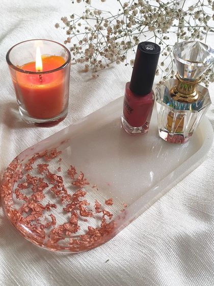 Here is the same oval tray styled with a candle, nail polish, and perfume. It shows how versatile these little trays can be for home organization and decor.