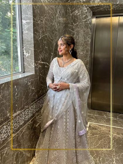 Elegance redefined. A client looking graceful in a white chikankari lehenga.