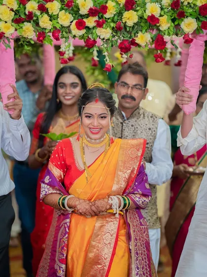 The grand entrance. Seeing my bride walk in under the floral canopy, looking confident and beautiful, is the best part of my job. The complete look, from the makeup to the hair and saree, is perfect for her big moment.