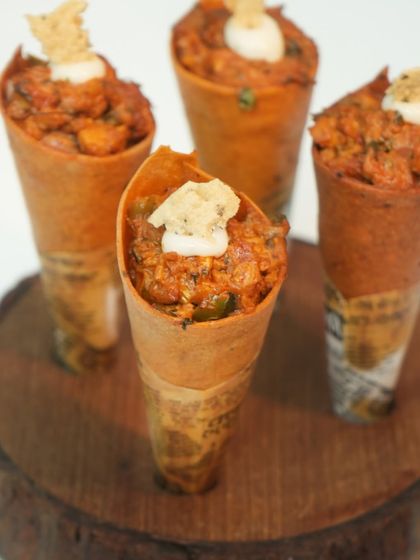 A familiar street-side snack, reimagined with our signature elegance. These crisp, hand-rolled cornetts are filled with a spiced mixture and finished with a dollop of delicious mousse.