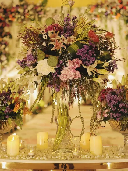 A close-up of the magnificent entrance floral arrangement, a mix of exotic flowers and lush greenery.