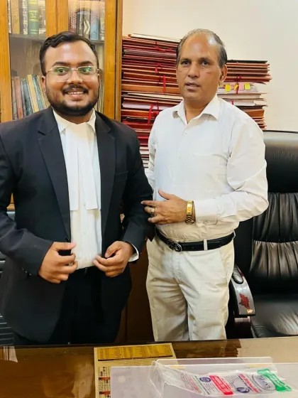 Advocate Amit Kumar with a senior associate after his band ceremony. We foster a supportive environment where every team member's professional growth is celebrated.