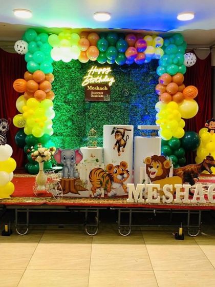 A wide shot of a jungle theme on a stage, perfect for larger venues.