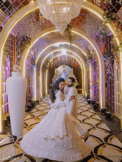 A fairytale moment captured in a grand, beautifully lit corridor. This is where we blend elegance and romance, creating stunning reception portraits that showcase your glamour and the beauty of your venue.