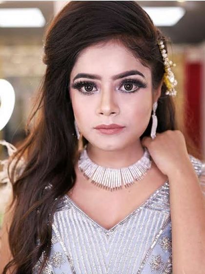 A modern and chic party look. This client paired a silver-grey gown with a contemporary diamond-look choker, both available for rent for your next big event.