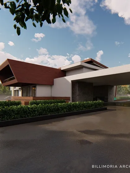 The entrance driveway leads under a wide, covered porte-cochère, providing a grand sense of arrival. The design uses a mix of stone, wood, and white render for a warm, contemporary material palette.