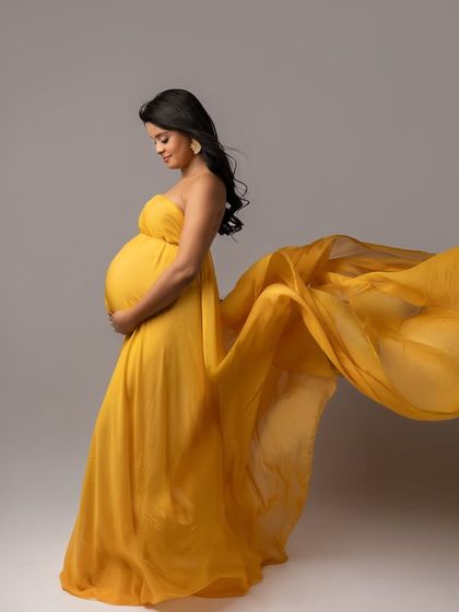 Wrapped in sunshine. This vibrant yellow gown brings so much joy and energy to the portrait, perfectly reflecting the happiness of this special time.
