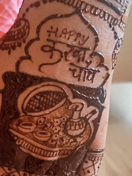 A close-up of a Karwa Chauth design, showing the traditional thali (plate) with diyas and the "Happy Karwa Chauth" message in Hindi.