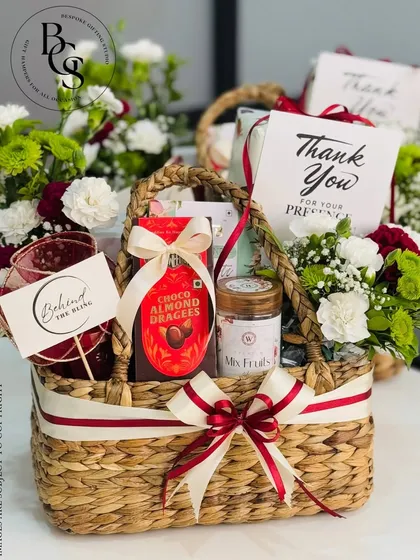 A simple 'Thank You' can be a powerful message. This beautifully arranged gift basket, combining gourmet selections with fresh flowers, is a classic and heartfelt way to express gratitude, perfect for showing appreciation to clients, partners, or anyone who has made a difference.