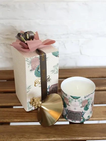 The Cactus Garden scented candle, with its unique print and gold pineapple lid. This piece brings a touch of desert charm and delightful fragrance to your home.