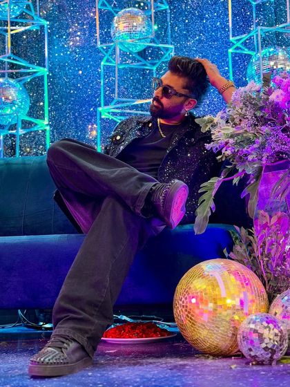 Chilling on a couch surrounded by disco balls. A rare moment of calm between gigs.