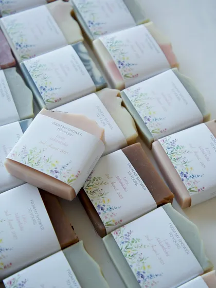 Rows of beautifully wrapped soaps, ready to be gifted to guests.
