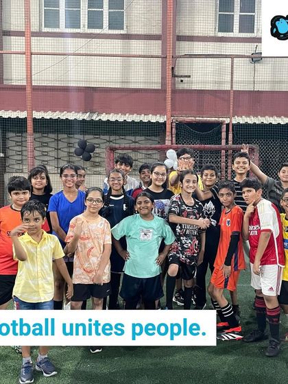 Football unites people, even our youngest players! A group of older kids stands together for a team photo, showcasing the friendships and community spirit that we build at our camps.