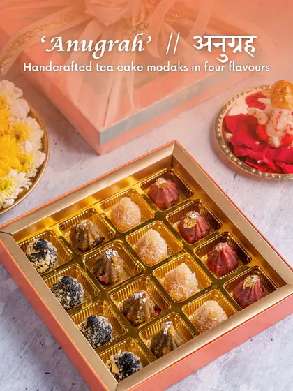 The 'Anugrah' box from our Ganesh Chaturthi collection, featuring handcrafted tea cake modaks in four different, delicious flavors. A sweet blessing for your festive celebrations.