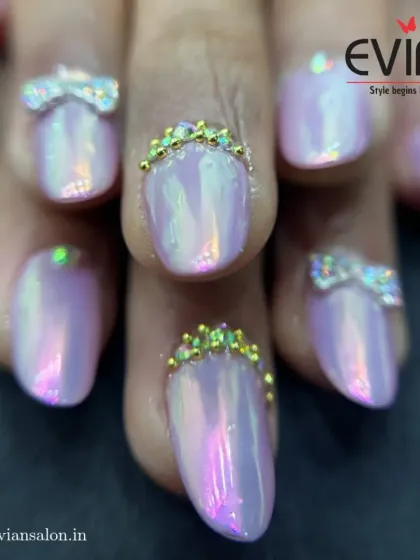 A close-up look at some of my most detailed work. These nails feature a pearlescent finish with hand-crafted rhinestone bows and tiny golden crowns at the cuticle, showing how small details can make a big impact.
