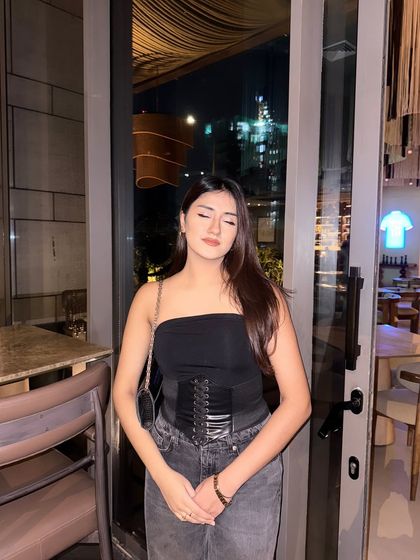 "Energy too expensive for void investments." A series of shots in my favorite all-black party look: a tube top, corset belt, and wide-leg jeans.