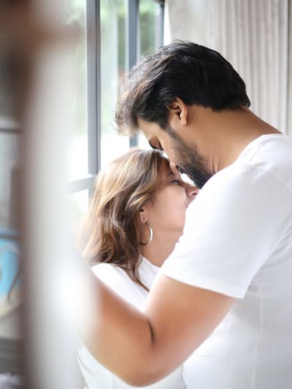 An intimate and tender moment between a couple, captured in soft, natural light. This close-up shot focuses purely on the emotion and connection.