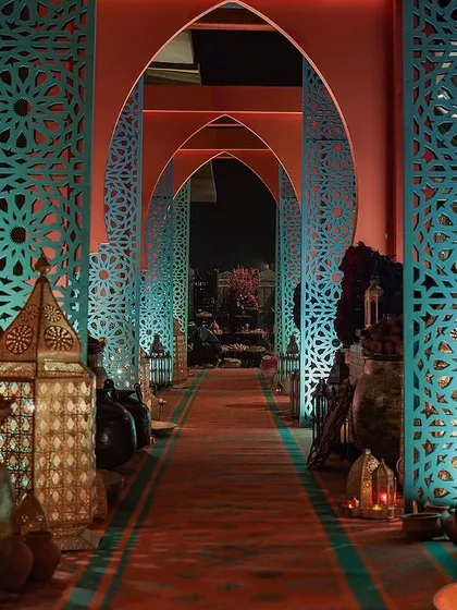 Our expertise lies in creating immersive themed events that transport guests to another time and place. This grand entrance, with its intricate archways and warm lanterns, was the gateway to an authentic Moroccan Bazaar experience, setting the stage for an evening of enchantment.