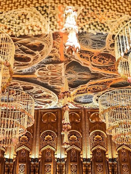 The stunning mogra chandeliers hanging from the ceiling of the mandap, a testament to our love for intricate floral work and traditional craftsmanship.