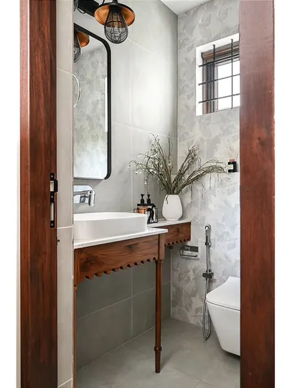 I believe powder rooms are the perfect place to make a bold statement. For this space, I designed a custom solid wood vanity with intricate spindle legs and arch details. It’s a small touch that delivers a big "wow" moment and sets a sophisticated tone right from the entryway.