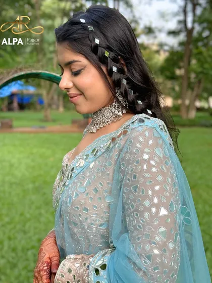 A side view of the mirror-detailed braid, a unique hairstyle for a modern Sangeet.
