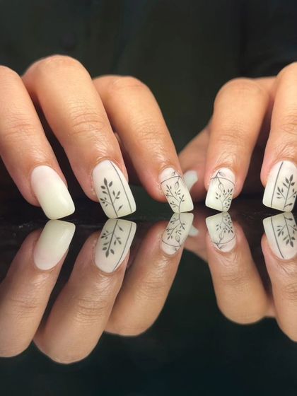 A full view of the elegant botanical line art nails.