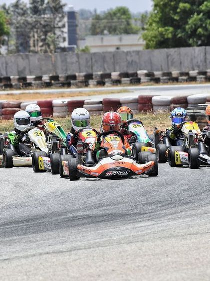 A group of Micro Max karts battling for position, highlighting the competitive spirit even among our youngest racers.