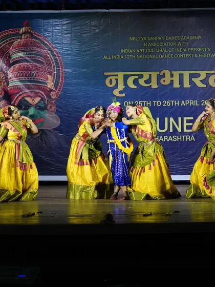 The playful spirit of Krishna and his friends is captured in this scene. Our stage productions are designed to be engaging and entertaining for the audience.