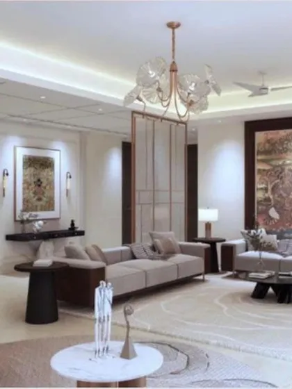 An expansive view of a modern 4BHK apartment living room at Platinum Tower, Gurgaon. This full interior renovation features a neutral color palette, statement art, and layered lighting to create a sophisticated and welcoming space.